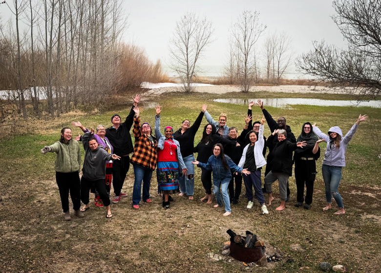 Group shot of Certificate cohort standing outside at Painted Sky Studio on Lake Manitoba