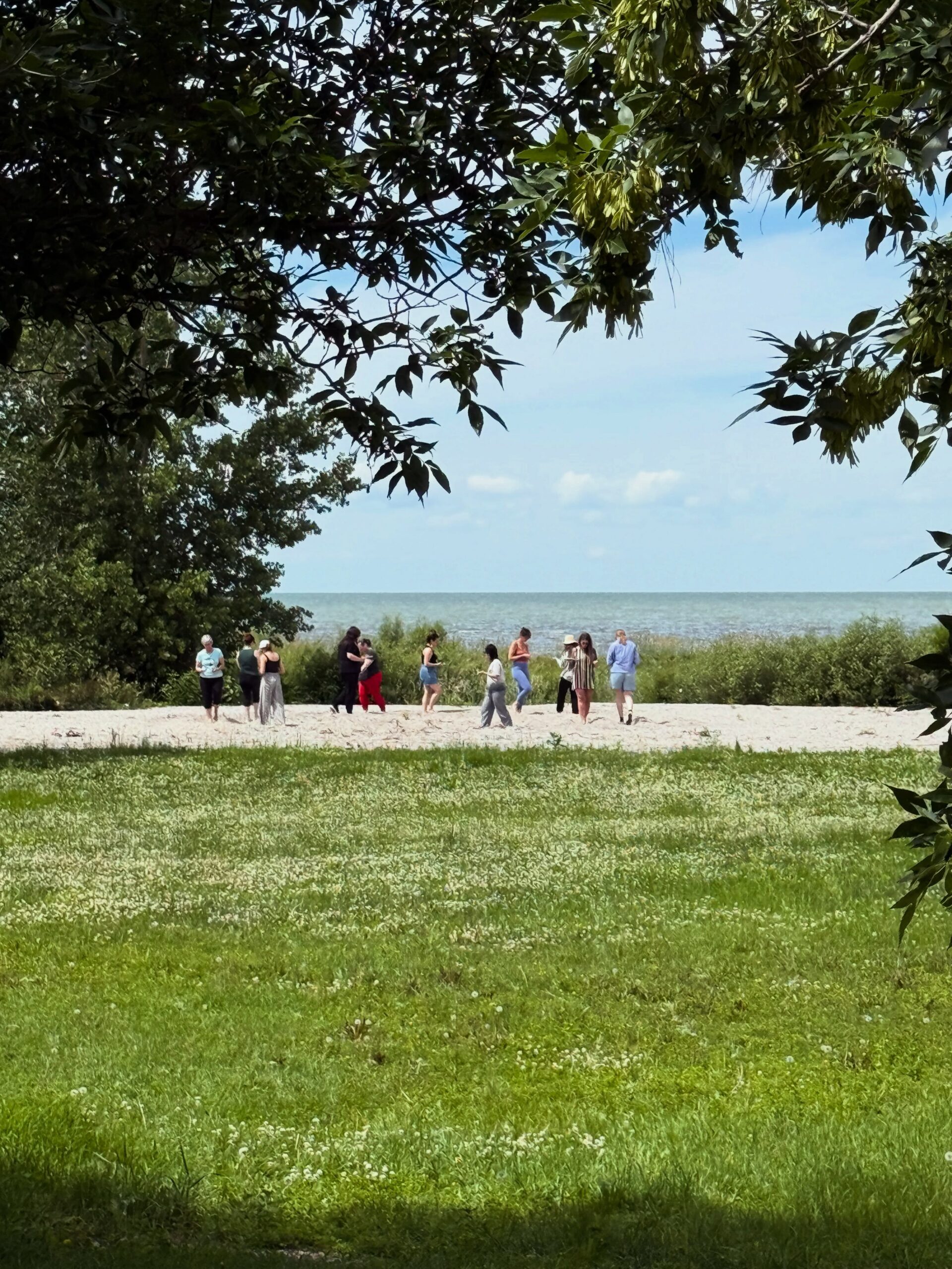Students seen in the distance along the shores of Lake Manitoba