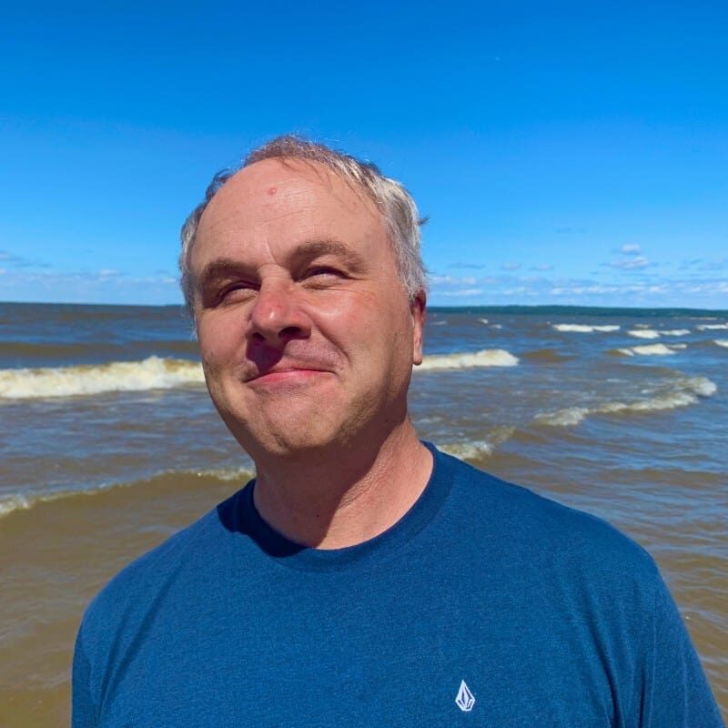 Bevan Klassen standing by lake.