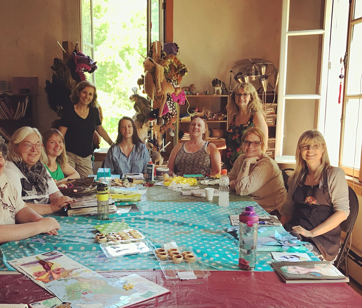 Group of people sitting around a table.