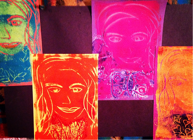 Four abstract portrait paintings.