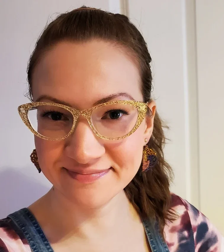 Person wearing gold glasses.