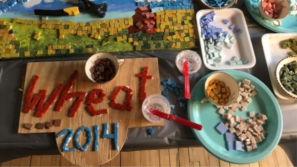 Mosaic tiles that say wheat 2014.
