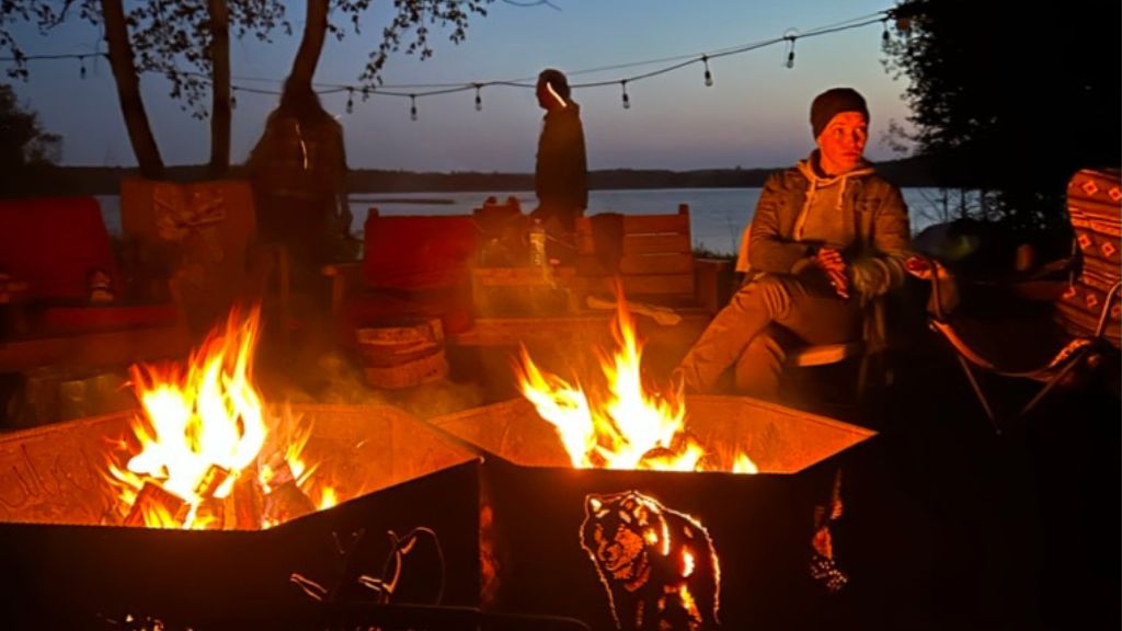 Group of people around fire pit.