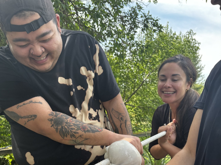 Two people working together on a art project.