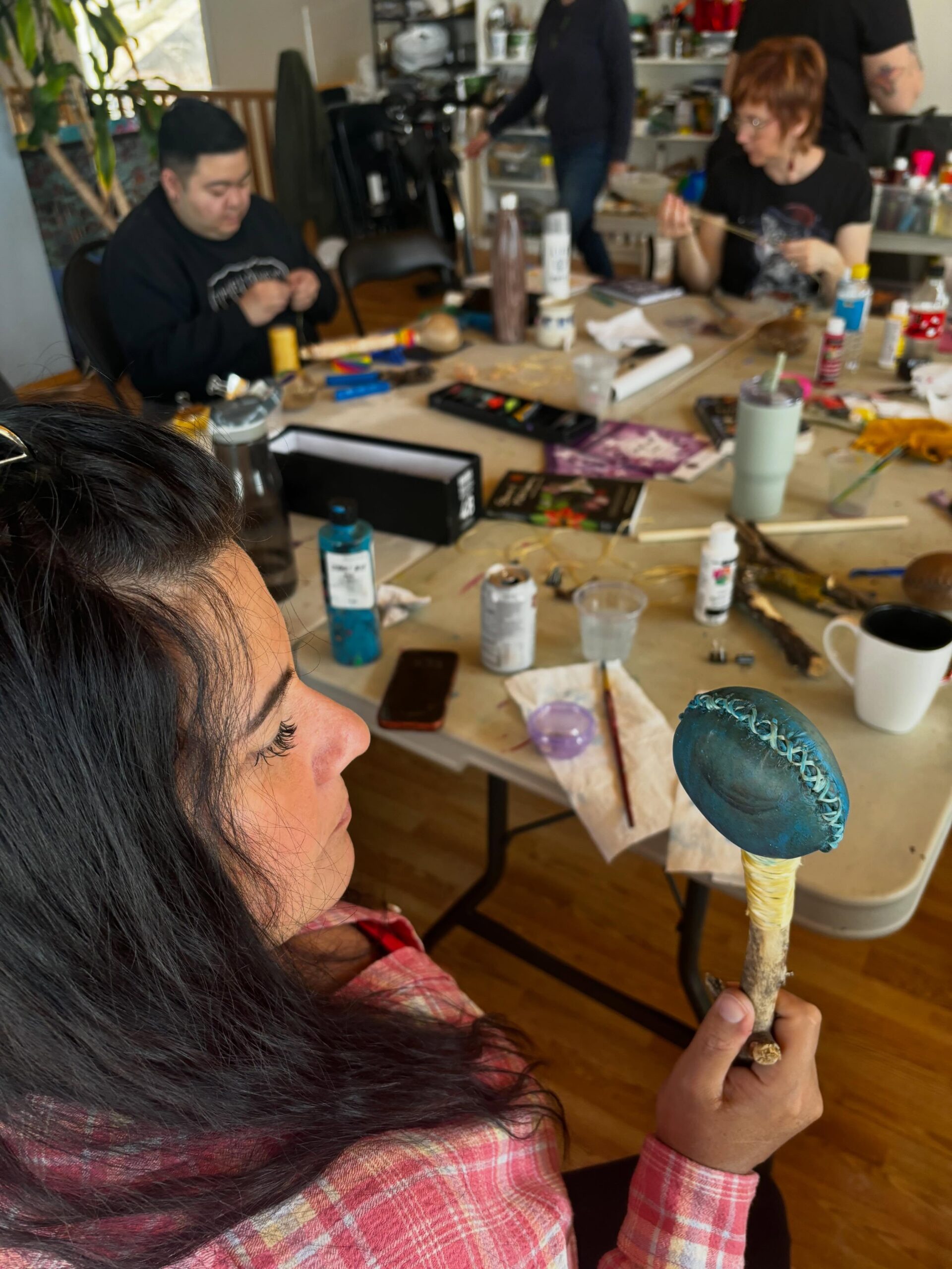 Group of students art-making around table at Painted Sky Studio
