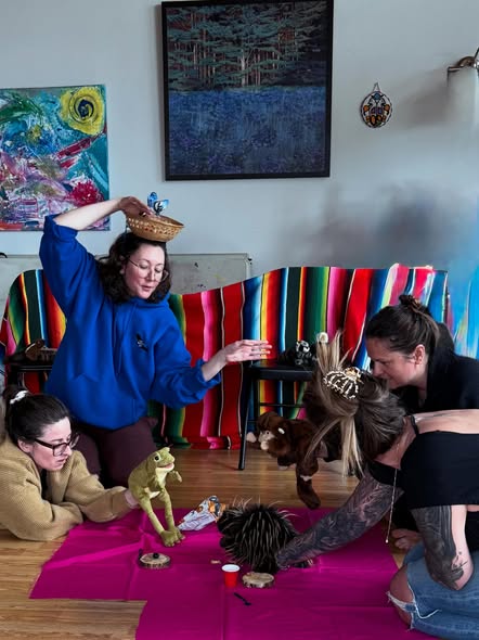 Four students with puppets inside Painted Sky Studio