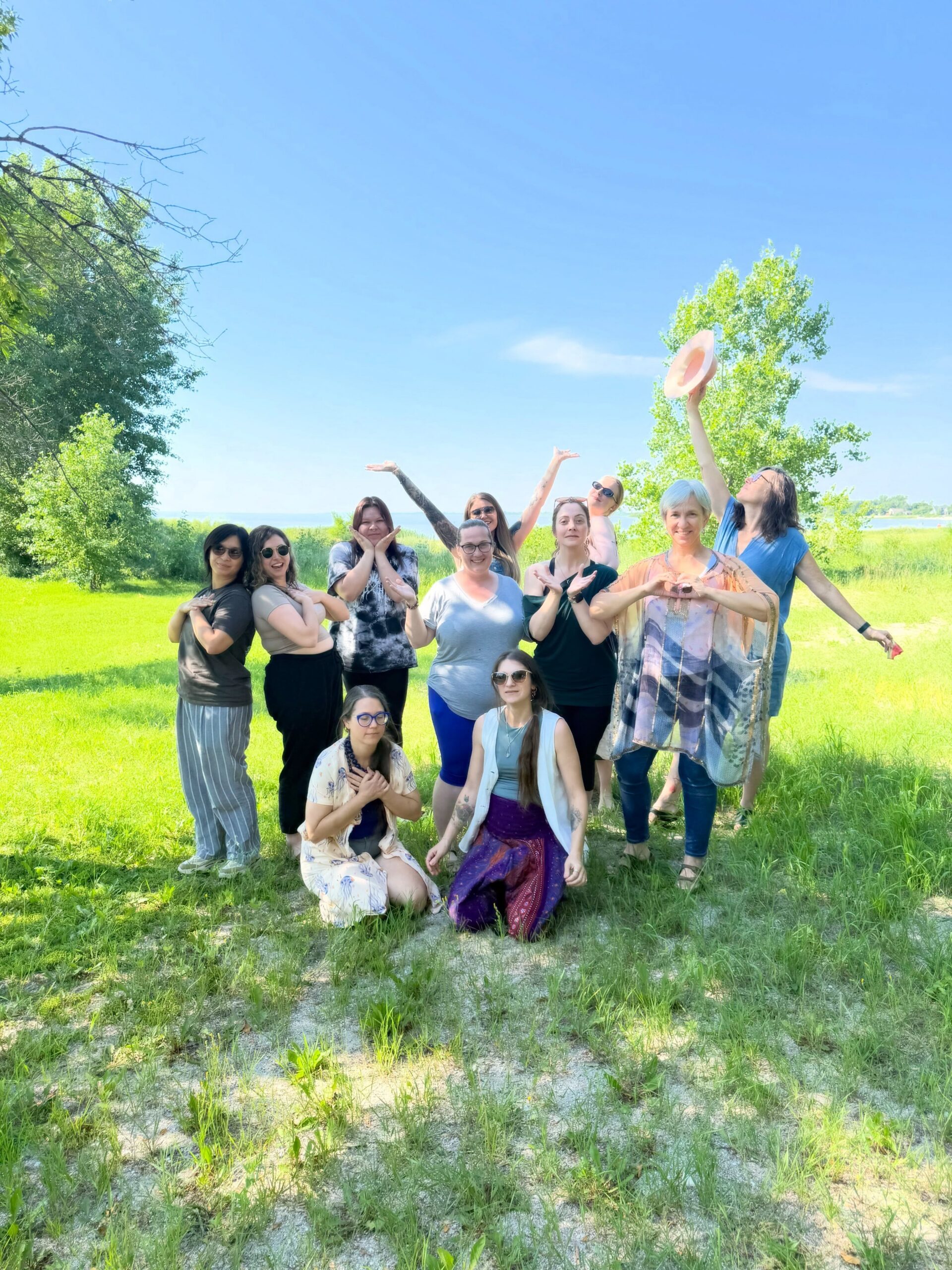 Group of students and art therapy instructor, Katrina Plato, standing outside of Painted Sky Studio on Lake Manitoba