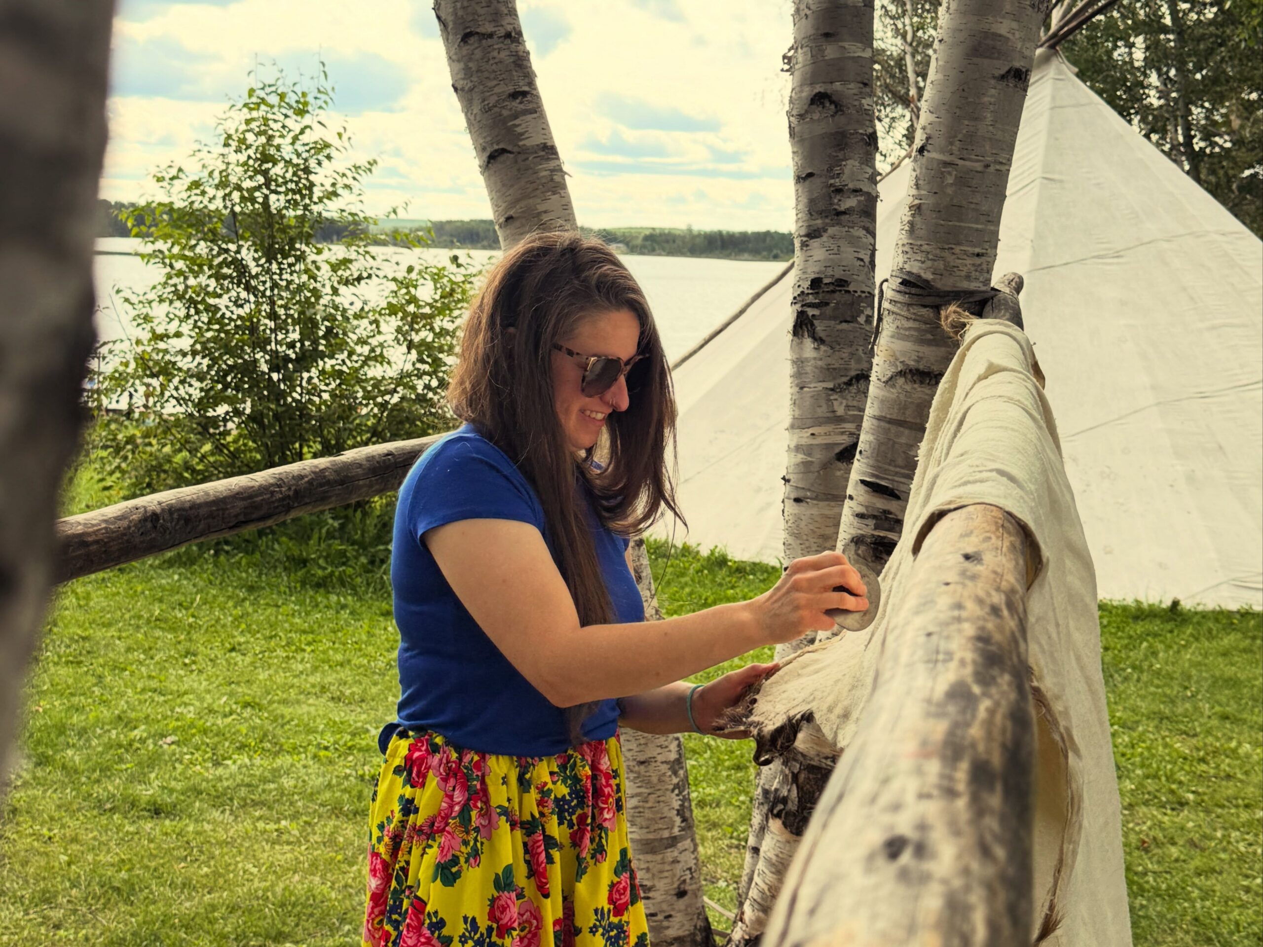 Student working on hide at kâniyâsihk Culture Camp